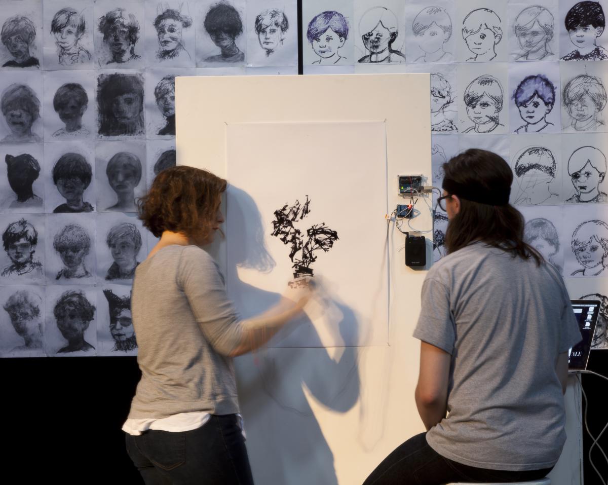 Artistic performance where the artists lose themselves to each other to jointly create a drawing.